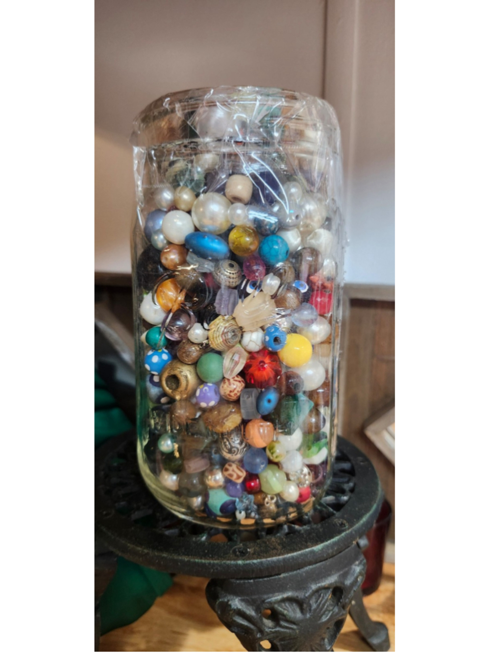 Jar of wooden beads and Plastic beads